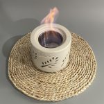 Small portable cement fireplace indoors