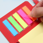 Multifunctional tearable notebook with pen